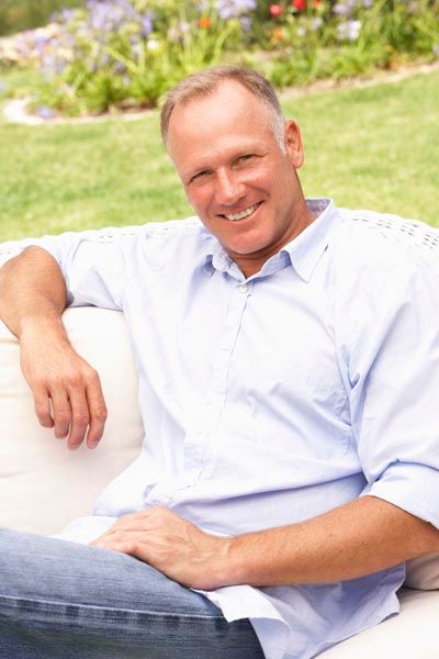 man smiling with dental implants from Pinnacle Dental Group