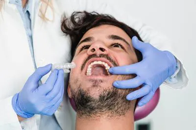 man getting Invisalign at Pinnacle Dental Group