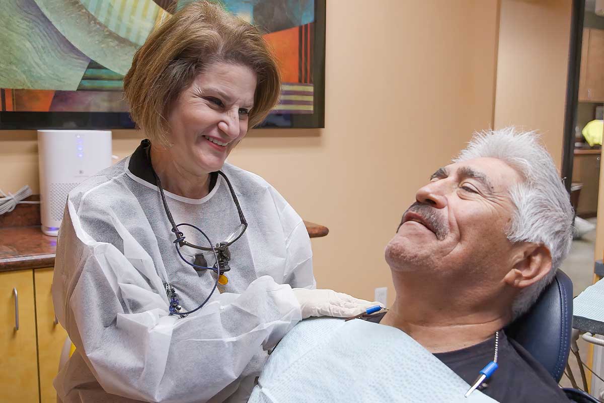 Dr. Maryam Bagheri, DDS of Pinnacle Dental Group educating patient on dental implants